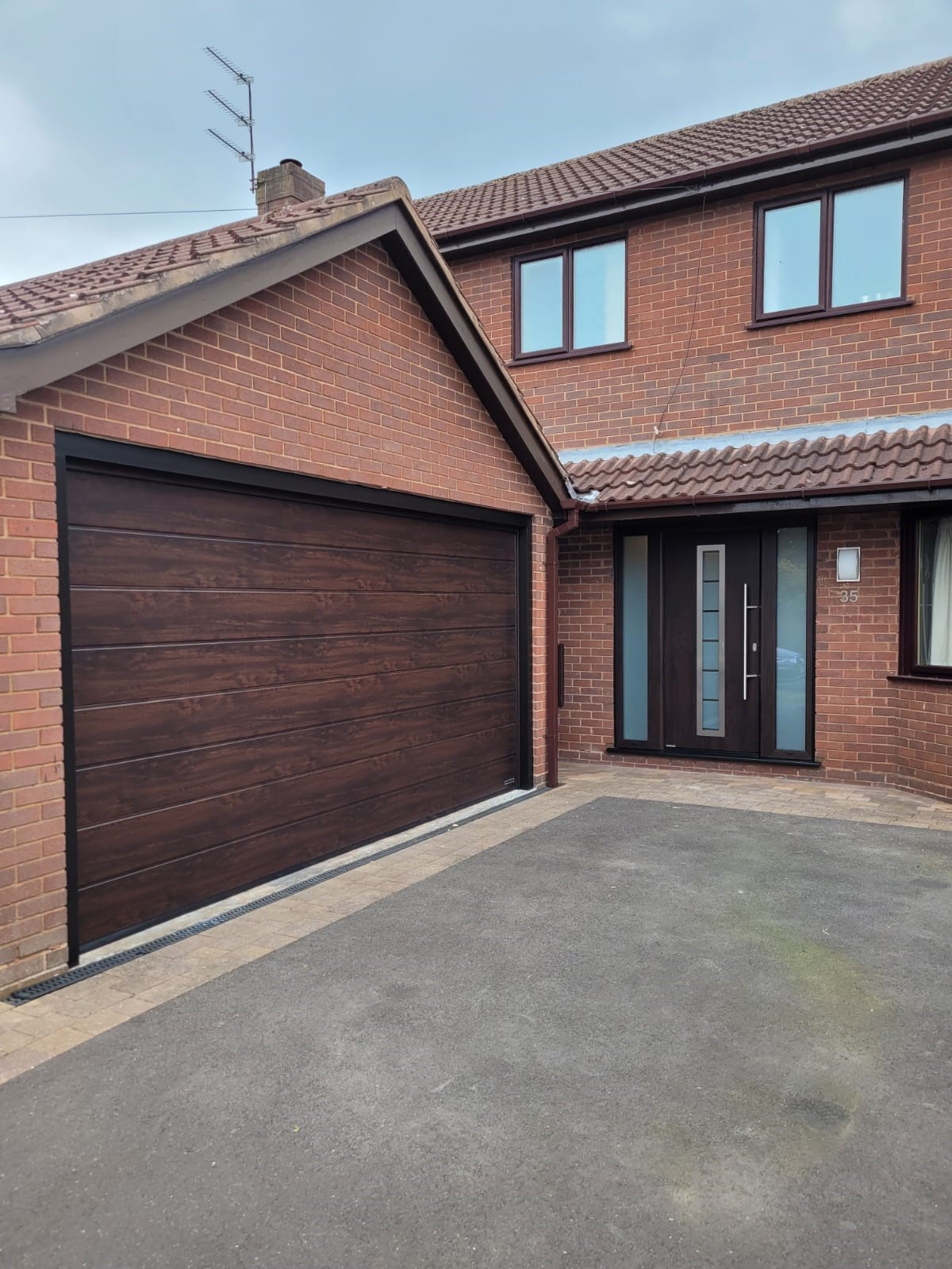 Matching Hormann Thermo65 and Sectional door in Night Oak