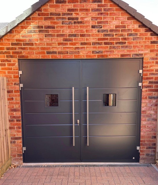 Dark grey side hinged garage door.